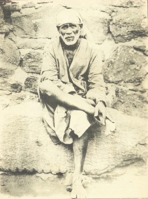This picture shows the first picture of Sai Baba. It was used by Late Shri. B. V. Talim as a guide when he was making the sculpture.